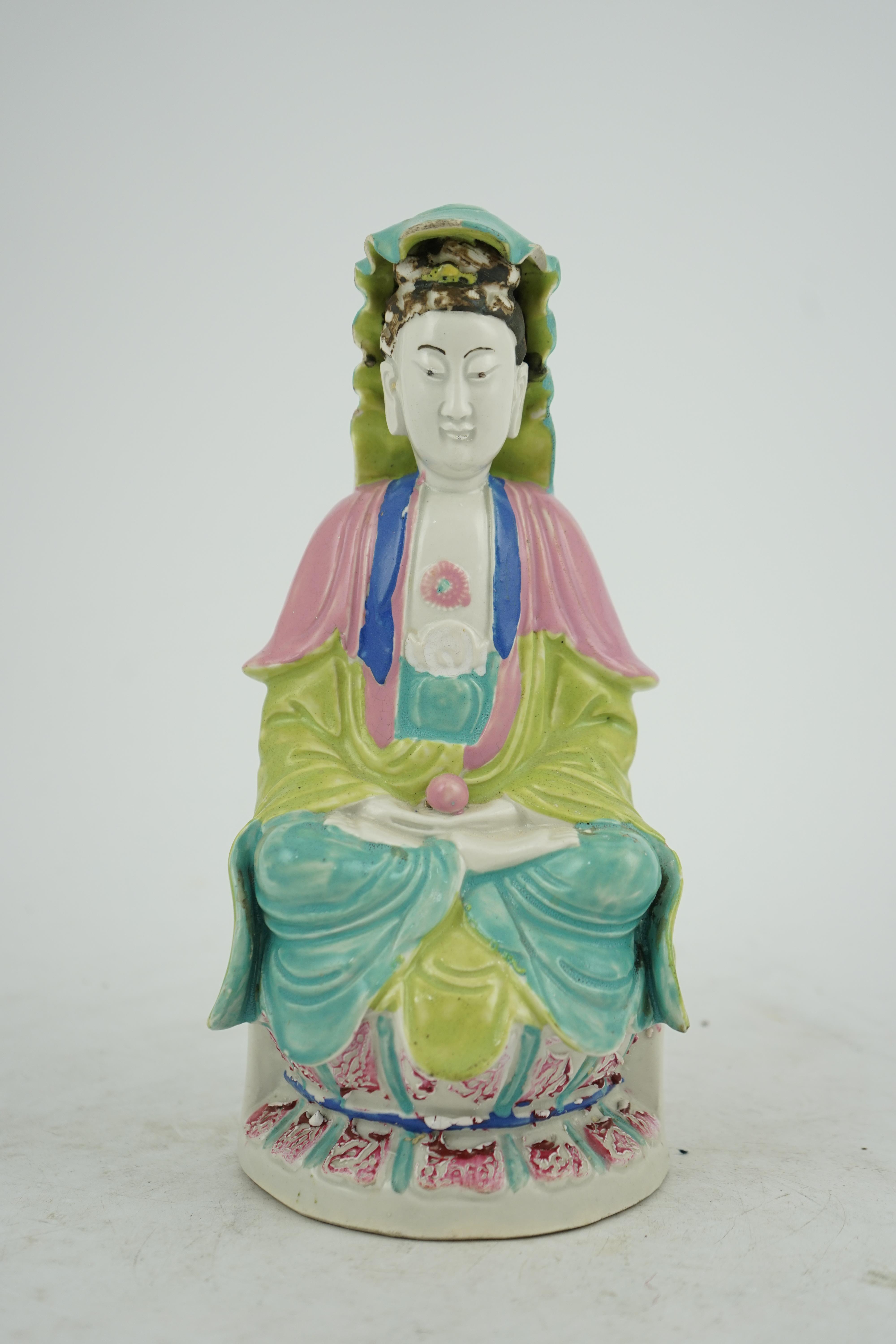 A Chinese Dehua polychrome enamelled blanc de chine figure of Guanyin, late 18th century